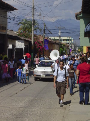 Is that a sousaphone player walking down the street?