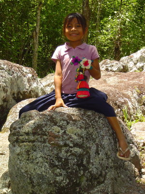 Rosita, a Maya-Chort poses on the ancient Mayan sapo (toad)