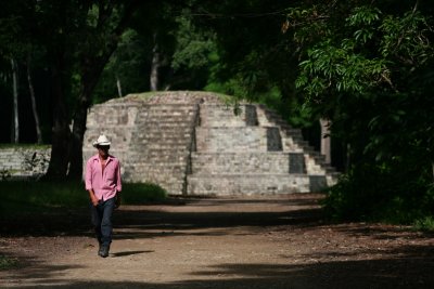 A campesino walks back from the ruins