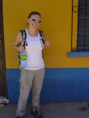 Crystal posing by a colorful house in Copn Ruinas