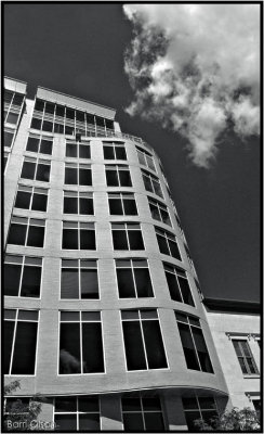 Building and a Cloud Floating By