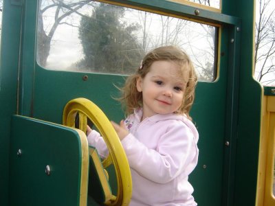 Driving the tractor at the park.