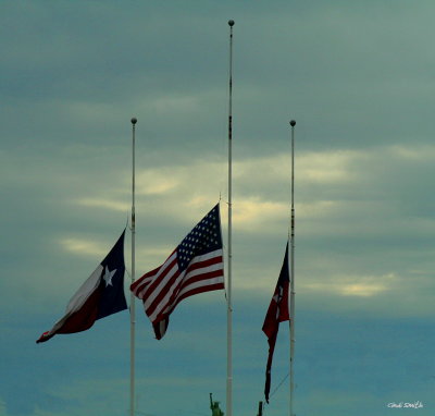 FLYING AT HALF STAFF
