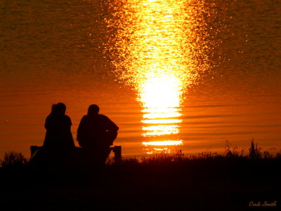 TALKING ON THE DOCK AT SUNSET