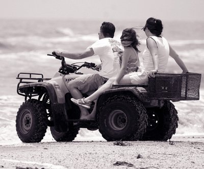 THREE FOLKS ON A FOUR WHEELER