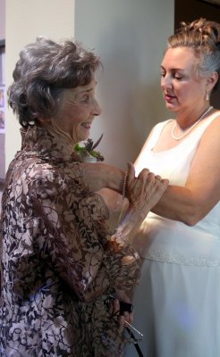 PINNING ON MOM'S CORSAGE