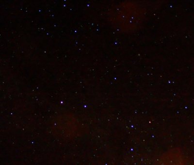 The Night Sky with the Southern Cross (four stars in a kite shape) in the Lower Right  Corner