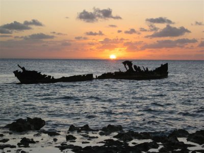 an old sailing ship that was used as a freighter which now rests in about 20 feet of water.