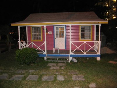 one of the small colorful houses alone the beach, this one is a Hertz car rental office