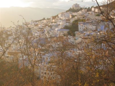 treking up a big hill, looking back at the city