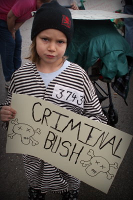 40 My little Ivy.  Her costume and sign was all her idea.  I only helped her spell 'criminal'!