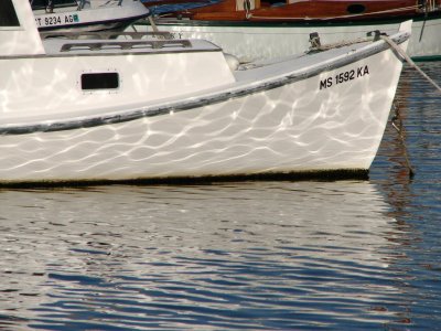 Water reflects boat-Boat reflects water.jpg