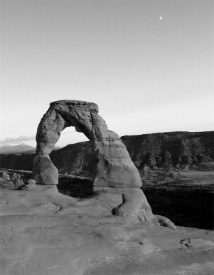 Delicate Arch at Sunset with the rising moon black and white.jpg