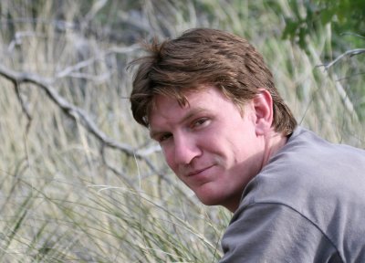 Will holding back grass for Black-Tailed Rattlesnake photos @ GUMO