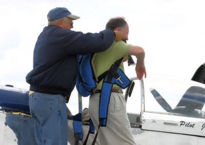 Pre-flight includes being fitted for a parachute.