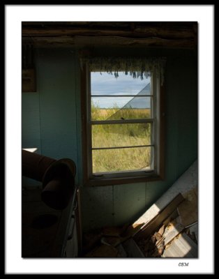 Looking out abandoned farmhouse window