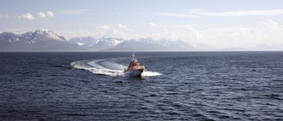 A Norwegian Coast Guard boat comes to pick up our final coastal pilot.