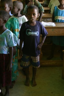 Boy singing at school in Kiwegu