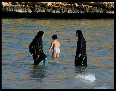 Boy taking a bath with his sisters - Oman 2004