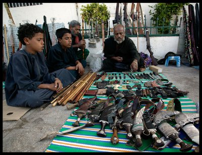 Old guns, ammo & daggers for sale at Salalah city centre market