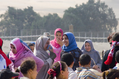 More locals. I like how colorful their headscarves are