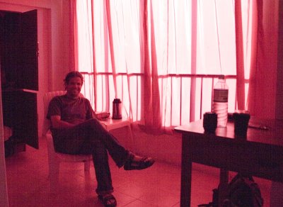 Ugly American, bathed in pink. The curtains in my hotel were this strange color, giving a brothelesque feel to the place