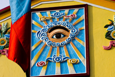 The eye represents god in Cao Dai. They worship, among others, Victor Hugo and Churchill