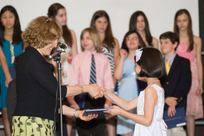 Receiving her diploma.