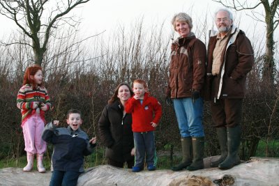 Family on the log - field at back of house