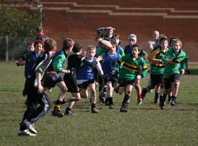 Ball going along the back line with Under 11's in pursuit