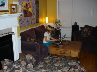 Kaitlyn at home on the laptop