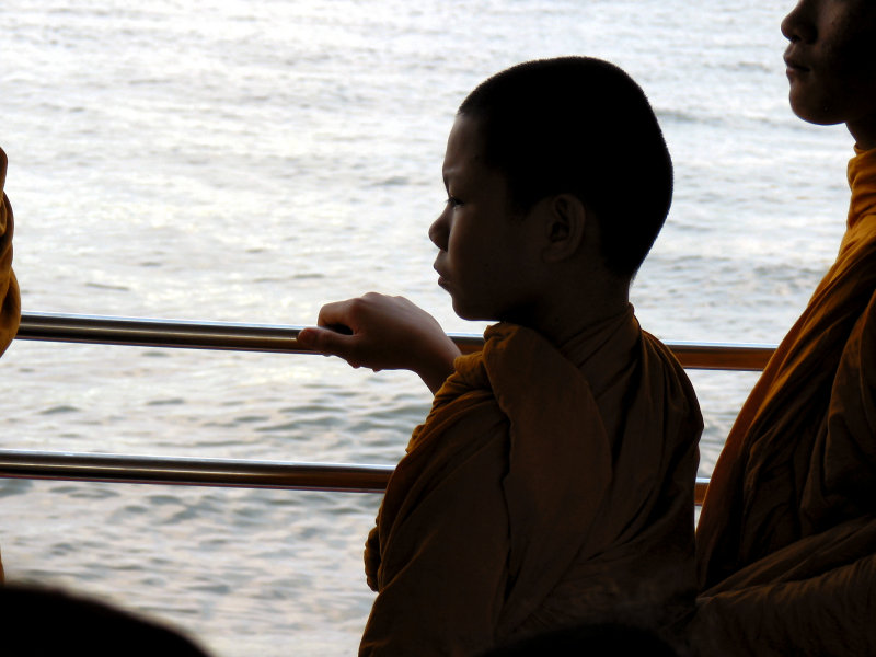 Young Buddhist Monk Deep in Thought on the River Bus