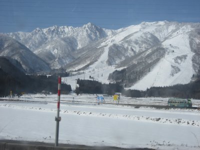 snow covered rice fields and mountain