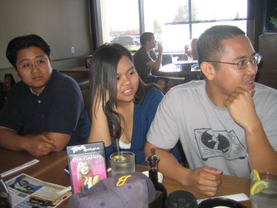 Ray, Maricar, & Victor checkin out the HUGE plate of sushi about to come their way.