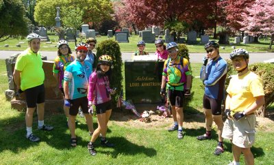 The Bike Friday Club of New York City visits the grave of Louis Armstrong.  Visiting Bike Friday factory cheerleader Lynette Chiang (front center left).