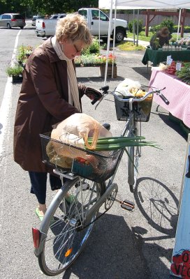 A local resident picking up some fresh vegetables at the Kinderhook Farmers' Market