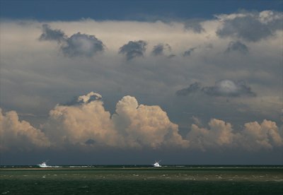 Returning charter boats & storm clouds