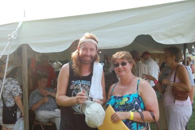 Mike Andes of Nothin Fancy signs a hat for a fan (mandolin and guitar)