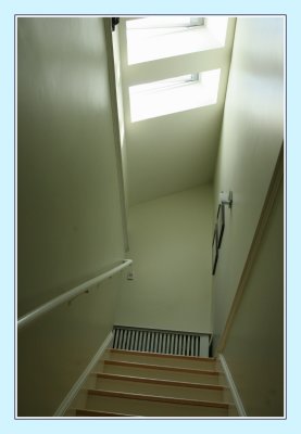 Stairs to upstairs bedroom + skylight