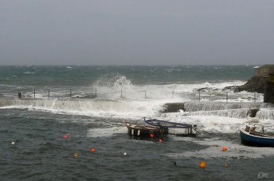 an extra high tide and inshore wind