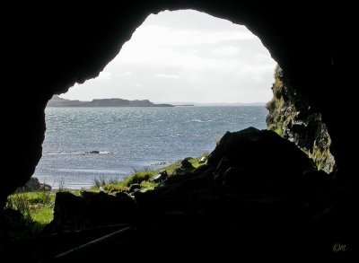 The whisky cave on the foreshore near Crackaig - remains of the still support in centre, good view of overkeen excise boats