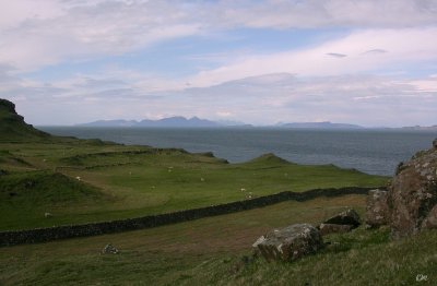 Rum, Eigg and Skye behind from Mornish uplands