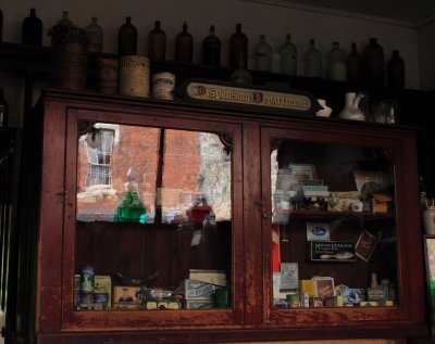 chemist's cabinet - apparently a 'time-warp' as created in 1929