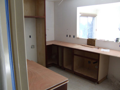 More cabinets begin to be placed and we can see where the counter tops will go.
