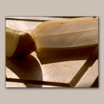 Apple and cheese slices on the cutting board