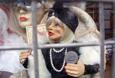 London window with dolls