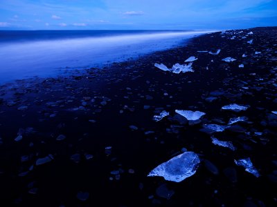 Iceberg Fragments On Black Sand
