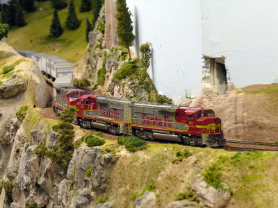 ... rounding the corner and heading for a tunnel, note the notch in the corner of the wall to clear doublestacks. NOTE: This area has since been altered and the wall corrected.