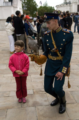 Little girl and soldier with hawk