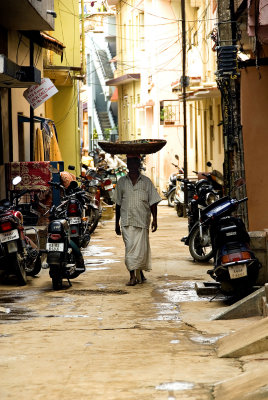 Man with basket on head